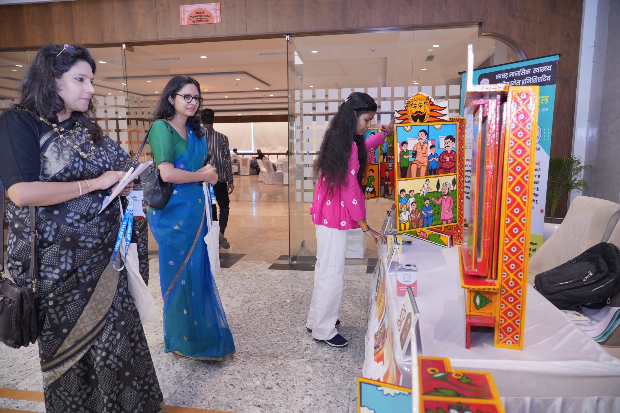 Delegates explore SHARP's Kaavad Mental Health Project exhibition, featuring Rajasthan's traditional storytelling art.